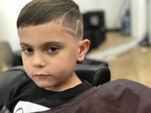 Picture of a handsome little boy and his haircut